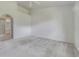 Light-filled bedroom with carpet, ceiling fan, and bathroom access at 21550 Clubside Loop, Lutz, FL 33549