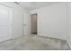 Bedroom with neutral carpet, ceiling fan and a large closet space at 21550 Clubside Loop, Lutz, FL 33549