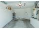Well-lit garage with storage shelves, water heater, and ample space for vehicles at 21550 Clubside Loop, Lutz, FL 33549