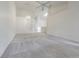 Open living room with neutral carpet, high ceilings, skylights, and chandelier at 21550 Clubside Loop, Lutz, FL 33549