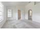 Bright main bedroom with neutral carpet, ensuite access and abundant natural light at 21550 Clubside Loop, Lutz, FL 33549