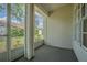 Screened-in porch offering views of a landscaped yard at 21550 Clubside Loop, Lutz, FL 33549