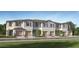 New townhouses with attached garages and grassy yards at 2631 Sunray Venus Way, Ruskin, FL 33570