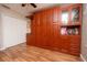 Bedroom with wood flooring, built-in wall unit, and large closet at 2633 Edgewater Falls Dr, Brandon, FL 33511