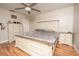 Main bedroom with king-size bed, dresser, and ceiling fan at 2633 Edgewater Falls Dr, Brandon, FL 33511
