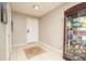 Neutral-toned entryway with tile floors and decorative rug at 2633 Edgewater Falls Dr, Brandon, FL 33511