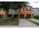 Two-story townhome with attached garage and landscaped front yard at 2633 Edgewater Falls Dr, Brandon, FL 33511