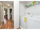 Convenient laundry room with washer, dryer, and shelving at 2633 Edgewater Falls Dr, Brandon, FL 33511