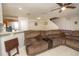 Spacious living room with sectional sofa and view of kitchen at 2633 Edgewater Falls Dr, Brandon, FL 33511