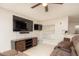 Living room featuring large TV, media console, and comfortable seating at 2633 Edgewater Falls Dr, Brandon, FL 33511
