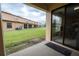 Private patio with view of community lawn and other homes at 2633 Edgewater Falls Dr, Brandon, FL 33511