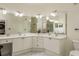 Double vanity bathroom with large mirrors and plenty of storage at 2749 Via Cipriani # 1032A, Clearwater, FL 33764