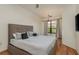Spacious bedroom with king-size bed and large window at 2749 Via Cipriani # 1032A, Clearwater, FL 33764