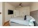 Bright bedroom with king-size bed and wood floors at 2749 Via Cipriani # 1032A, Clearwater, FL 33764