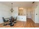 Open dining area with glass table and modern chairs at 2749 Via Cipriani # 1032A, Clearwater, FL 33764