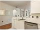 Modern kitchen with white cabinets and stainless steel appliances at 2749 Via Cipriani # 1032A, Clearwater, FL 33764