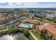 Aerial view of community pool with surrounding landscaping at 2749 Via Cipriani # 1032A, Clearwater, FL 33764