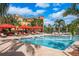 Community pool with adjacent volleyball court at 2749 Via Cipriani # 1032A, Clearwater, FL 33764