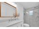 Modern bathroom with a large walk-in shower and a white vanity at 2766 Brattle Ln, Clearwater, FL 33761