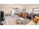 Bright living room with ample seating, a modern table, and neutral carpet at 3121 Satilla Loop, Odessa, FL 33556