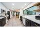 Modern kitchen with white and dark cabinets and a pool view at 3311 San Mateo St, Clearwater, FL 33759