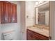 Bathroom with granite countertop and wood cabinets at 5100 Burchette Rd # 2802, Tampa, FL 33647