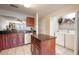 Kitchen features granite countertops, dark wood cabinets, and an island at 5100 Burchette Rd # 2802, Tampa, FL 33647