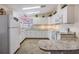 White cabinets and granite countertops in a galley kitchen at 5244 Montego Dr, Zephyrhills, FL 33541