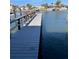 Private dock extending over calm water, offering waterfront access at 569 Boca Ciega Point N Blvd # 2602, St Petersburg, FL 33708