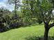 Well-manicured backyard featuring lush lawn and a rod iron fence along the property line at 5935 Maidenstone Way, Palmetto, FL 34221