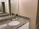 Bathroom featuring granite countertop and updated fixtures at 6388 93Rd N Ter # 4603, Pinellas Park, FL 33782