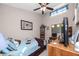 Cozy bedroom with a ceiling fan, and a blue and brown comforter at 6388 93Rd N Ter # 4603, Pinellas Park, FL 33782