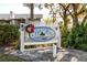 Exterior view of Lake Forest community sign with a red and green wreath at 6388 93Rd N Ter # 4603, Pinellas Park, FL 33782
