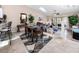 Open-concept dining room featuring a skylight and sliding doors to the balcony at 6388 93Rd N Ter # 4603, Pinellas Park, FL 33782