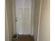 Entryway of the house with a white door and neutral walls at 6388 93Rd N Ter # 4603, Pinellas Park, FL 33782