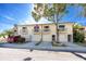 Two-story townhomes with garages, front balconies, and manicured landscaping at 6388 93Rd N Ter # 4603, Pinellas Park, FL 33782