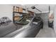Spacious two-car garage with ample storage space, car, and shelves at 6388 93Rd N Ter # 4603, Pinellas Park, FL 33782