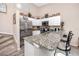 Modern kitchen featuring stainless steel appliances, granite countertops and white cabinetry at 6388 93Rd N Ter # 4603, Pinellas Park, FL 33782