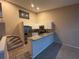 Modern kitchen with stainless appliances, granite counters and a breakfast bar at 6388 93Rd N Ter # 4603, Pinellas Park, FL 33782