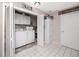 Bright laundry room with a washing machine, dryer, and additional storage cabinets at 6388 93Rd N Ter # 4603, Pinellas Park, FL 33782