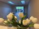 Living room view with tulips in foreground at 6388 93Rd N Ter # 4603, Pinellas Park, FL 33782