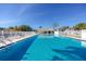 Large community pool with ample lounge chairs for residents to enjoy the Florida sunshine at 6388 93Rd N Ter # 4603, Pinellas Park, FL 33782
