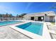 Community pool with sun loungers and a covered area providing shade for residents to relax and enjoy the amenities at 6388 93Rd N Ter # 4603, Pinellas Park, FL 33782