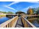 Picturesque wooden bridge extending over a calm lake at 6388 93Rd N Ter # 4603, Pinellas Park, FL 33782