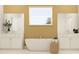 Spa-like bathroom with a freestanding tub and dual vanities at 6915 E 115Th St, Palmetto, FL 34221