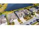 Aerial view of a house near a lake in a quiet neighborhood at 7506 Parkshore Dr, Apollo Beach, FL 33572