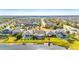 Aerial view of a house and neighborhood with a lake at 7506 Parkshore Dr, Apollo Beach, FL 33572