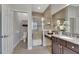 Bathroom with walk-in shower, toilet, and vanity with granite countertop at 7506 Parkshore Dr, Apollo Beach, FL 33572