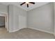 Simple bedroom with double door closet and ceiling fan at 7506 Parkshore Dr, Apollo Beach, FL 33572
