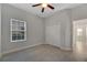 Bright bedroom with tile flooring, double door closet, and ceiling fan at 7506 Parkshore Dr, Apollo Beach, FL 33572